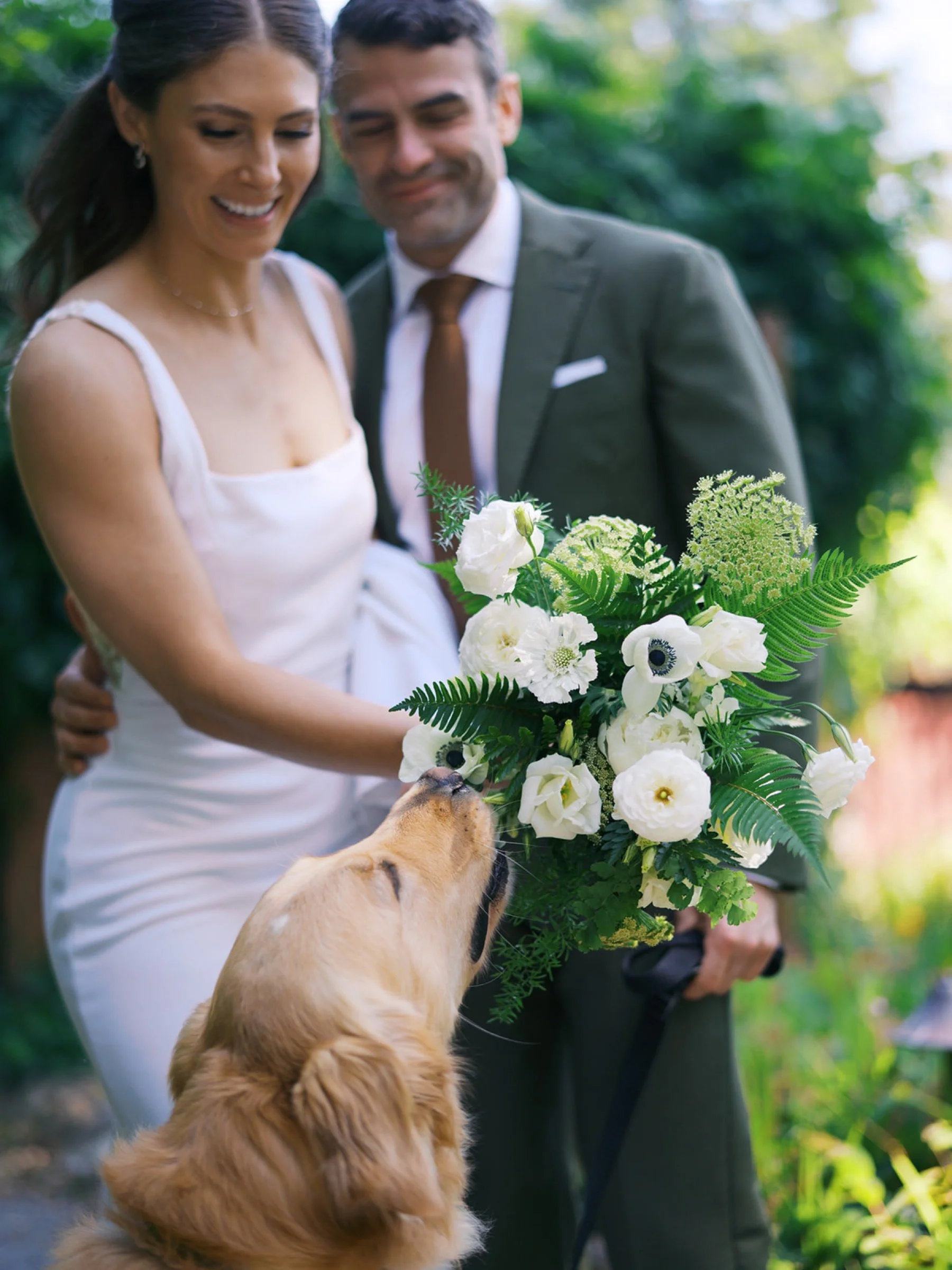 21_A golden retriever trying to eat the bride’s flowers at a wedding on whidbey island at the Captain Whidbey inn.jpg