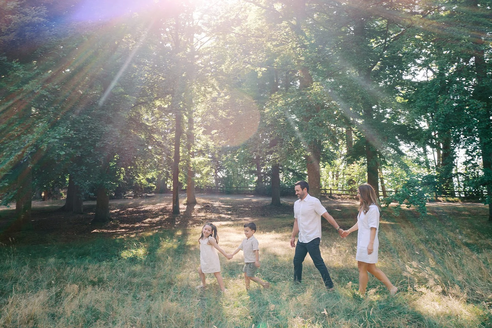 a candid film documentary style family portrait in Lincoln Park in summer by Seattle Family photographer Ryan Flynn