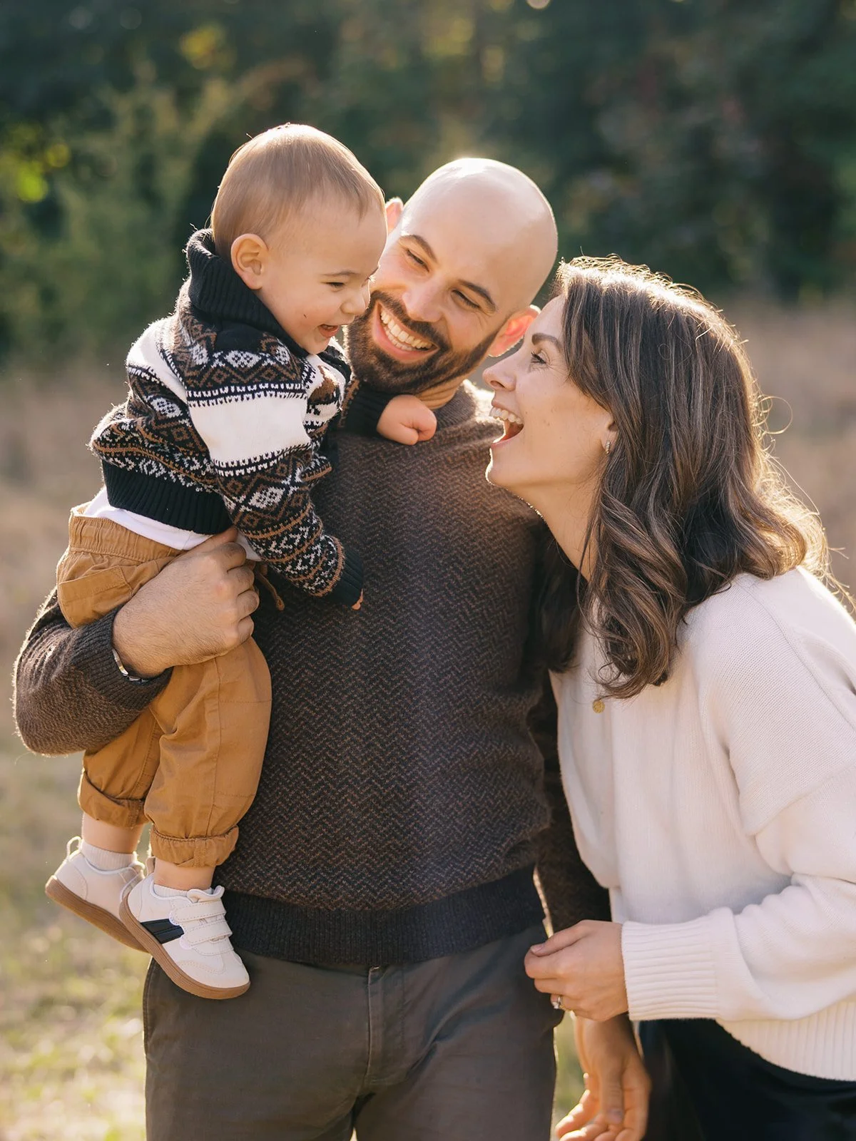 a natural film documentary style family portrait in Discovery Park in autumn by Seattle Family photographer Ryan Flynn