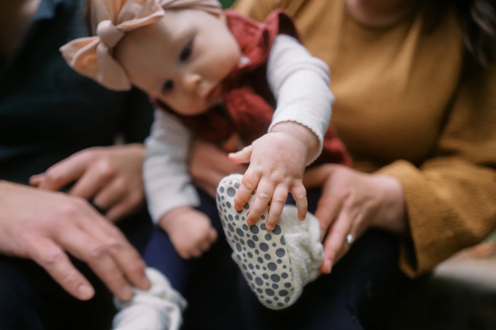 a portrait of a baby grabbing it's tiny toes by Seattle family photographer Ryan Flynn