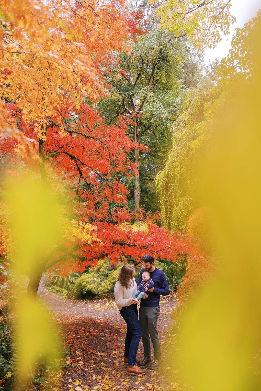 colorful and rainy fall family portraits in the Seattle arboretum by Ryan Flynn Photography