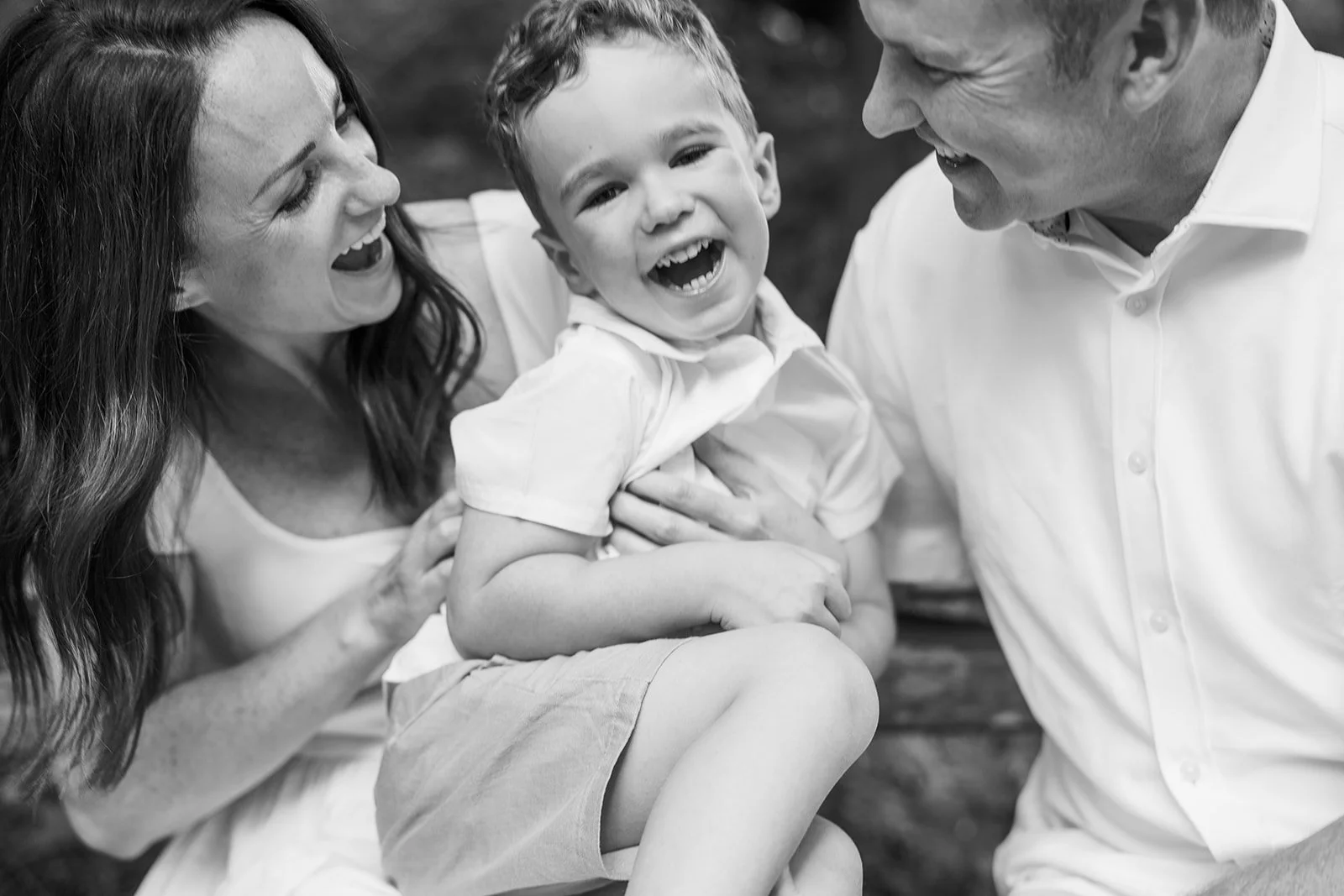 a unposed candid-style documentary family portrait in the Seattle Arboretum by Seattle Family photographer Ryan Flynn