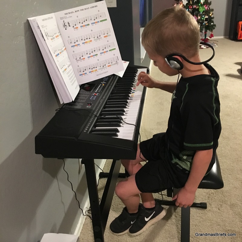  Camden practicing on the new keyboard. 