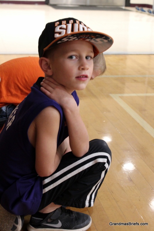  Camden patiently enjoying his big brothers basketball game 