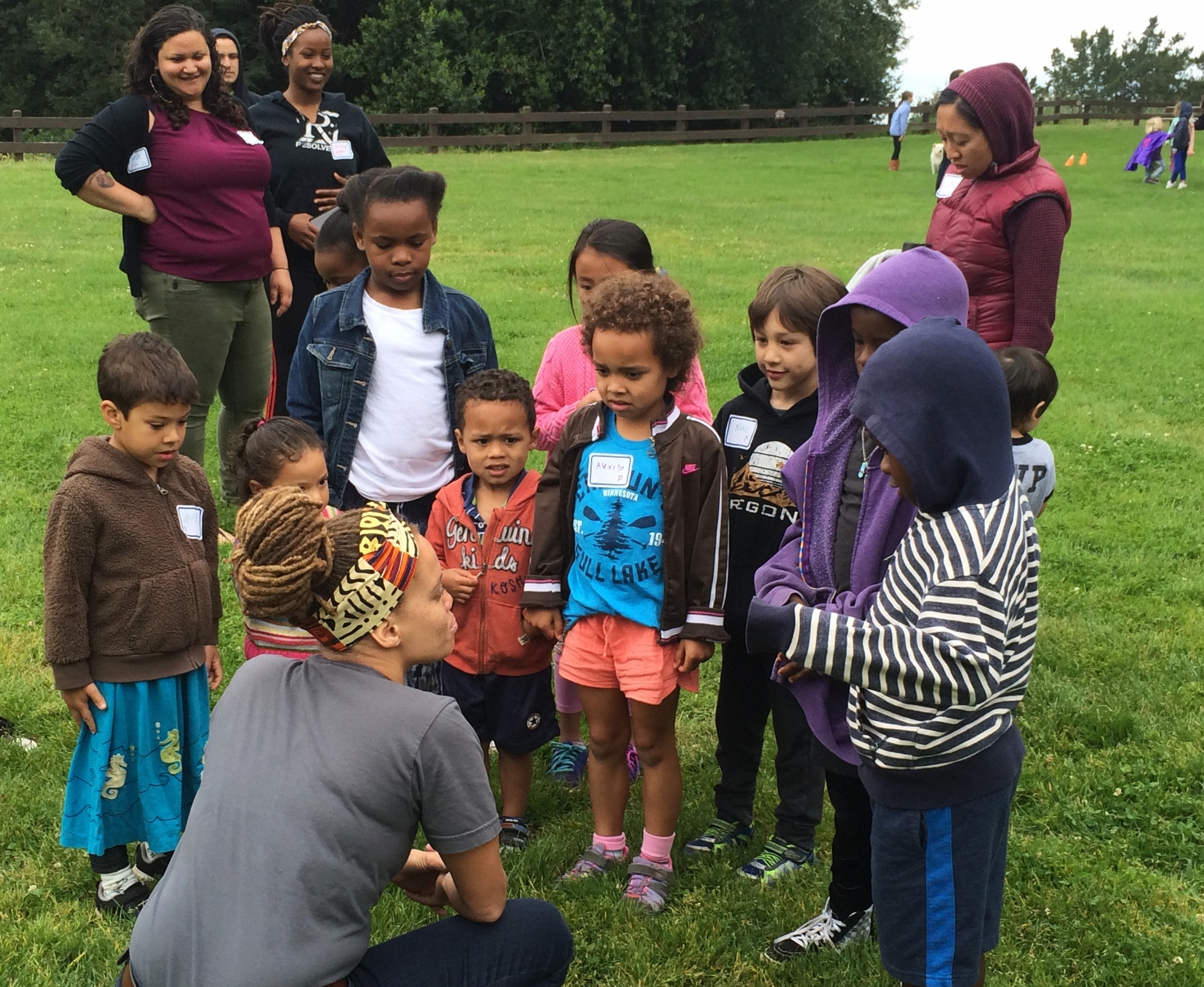 Shayna Cureton, Director of Abundant Beginnings, engaging in dialogue with children at the May 14th "Play, Power, and Privilege Teach-In for Children".