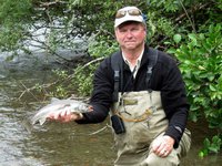 Clint enjoying one of his signature activities, fishing.