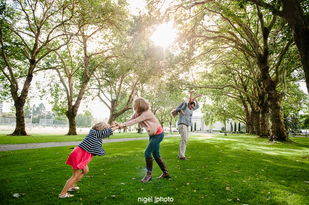 family-photos-seattle-eastside-playing-under-trees.jpg