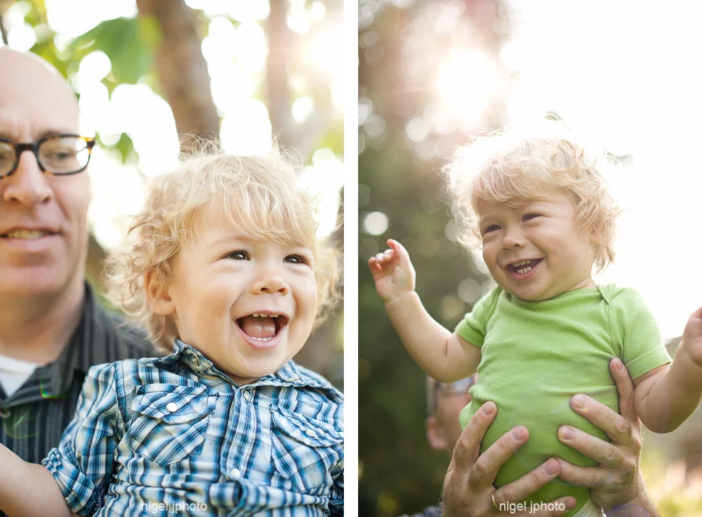 portrait-one-year-old-boy-held-by-father-backlit-seattle.jpg