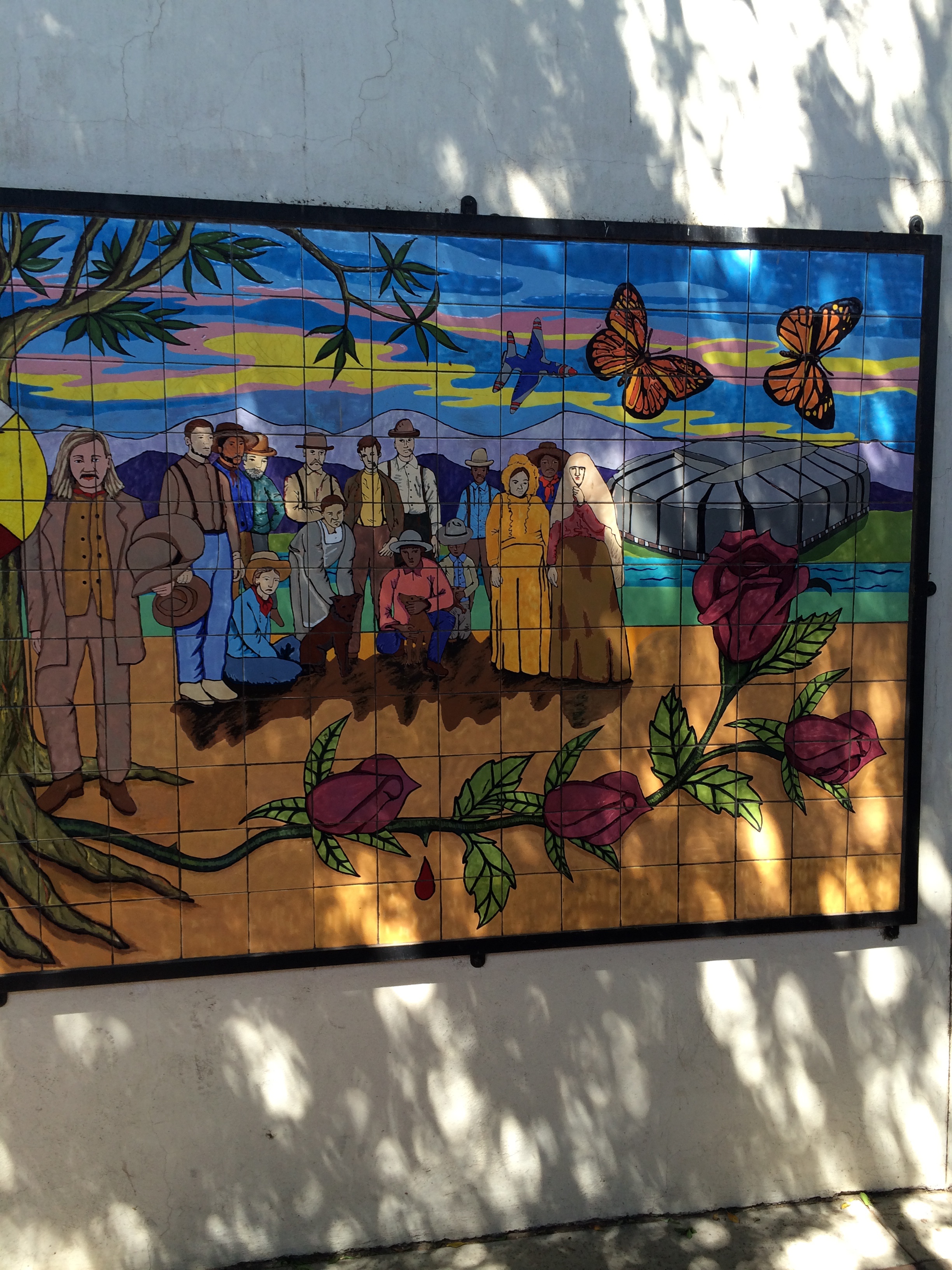 Mural in Downtown Glendale. Note the giant silver stadium and the fighter jet. 
