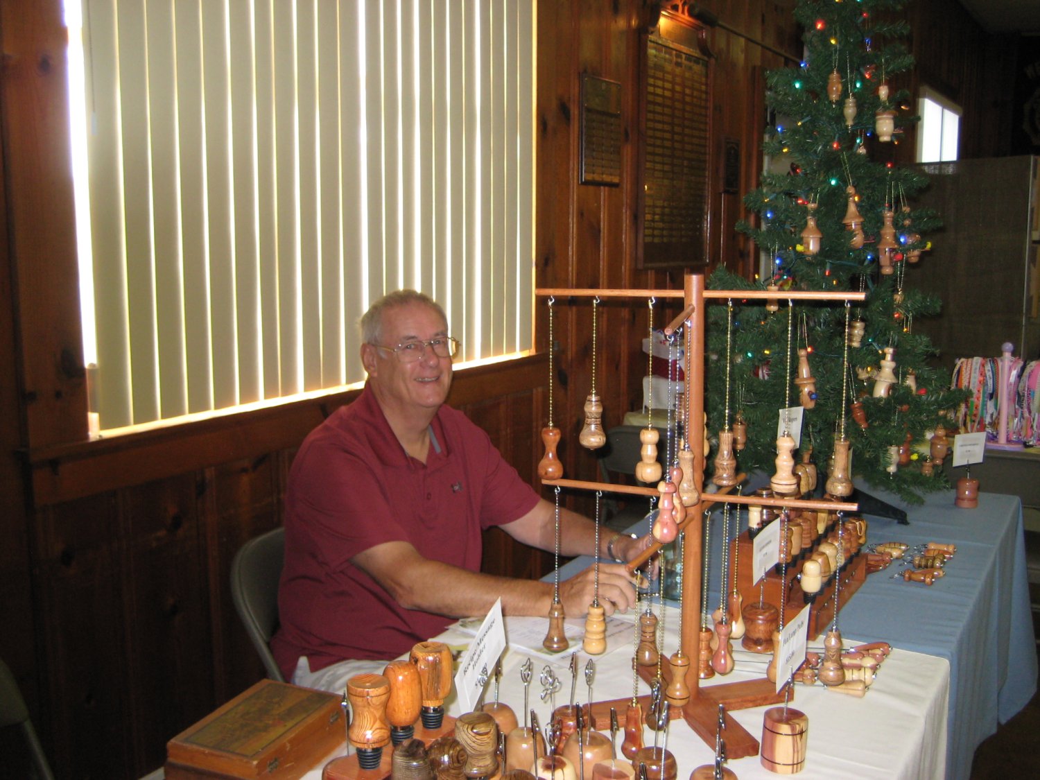  Dave Peterson and his handcrafted wooden bottle stoppers, ornaments, letter openers, etc.  