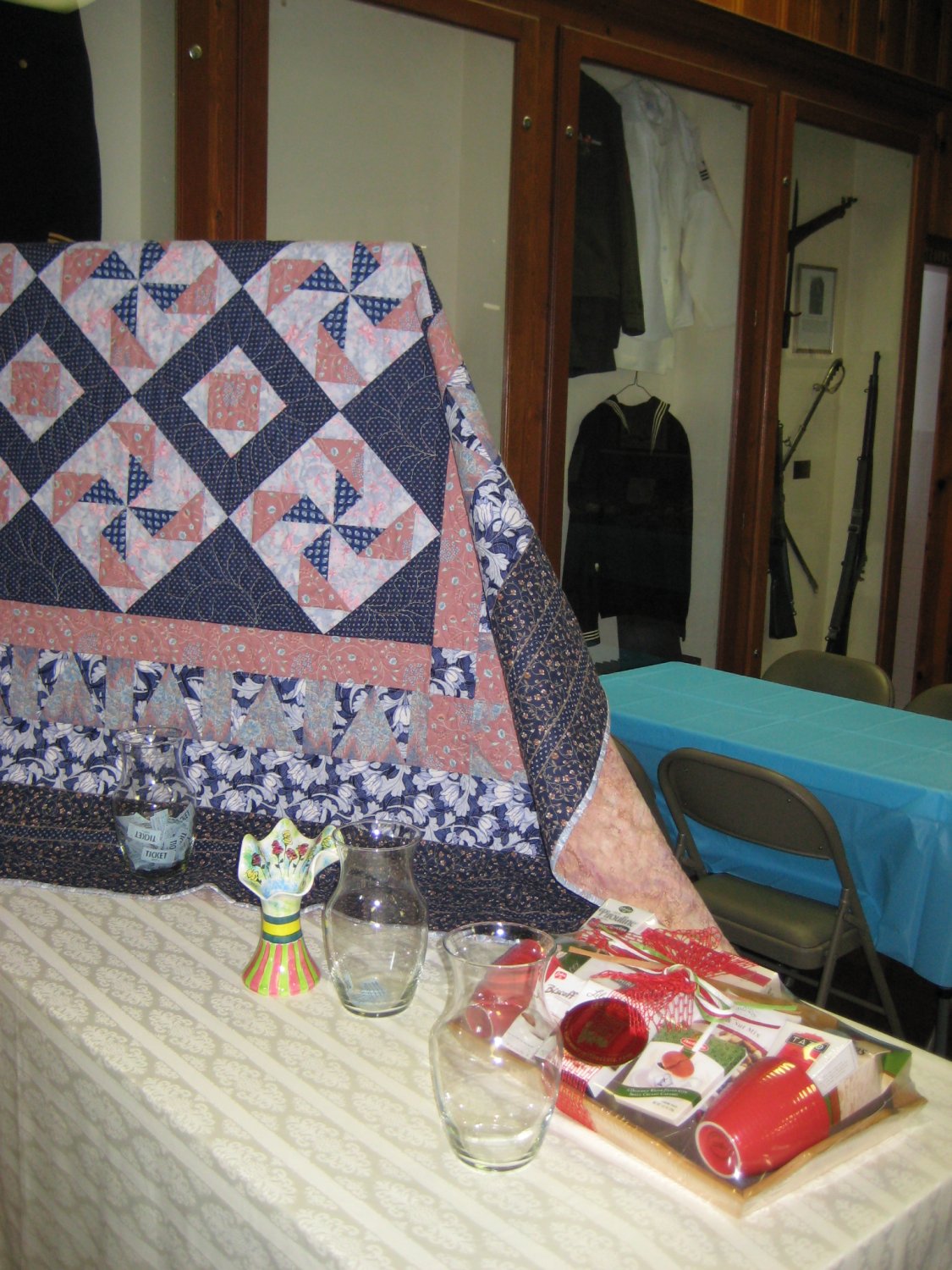  Raffle Items: The quilt was handcrafted and donated by Alice Washburn, Nancie Cameron's sister; the ceramic vase was handcrafted and donated by Teri Nudo; and the Coffee and Tea Gift Basket was donated by Loretta Quigley.&nbsp; 