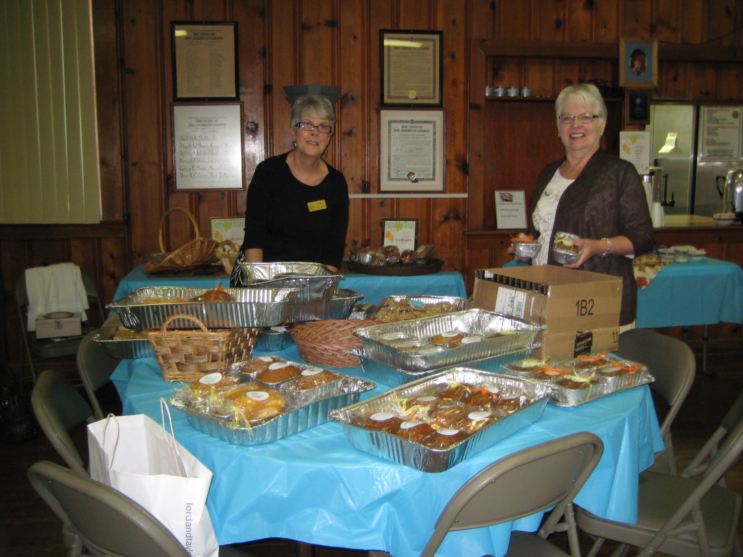  Willie DiLaura and Shirley Clark prepare mini-quick breads for sale and ready the cookies and brownies to be included in the box lunch.  