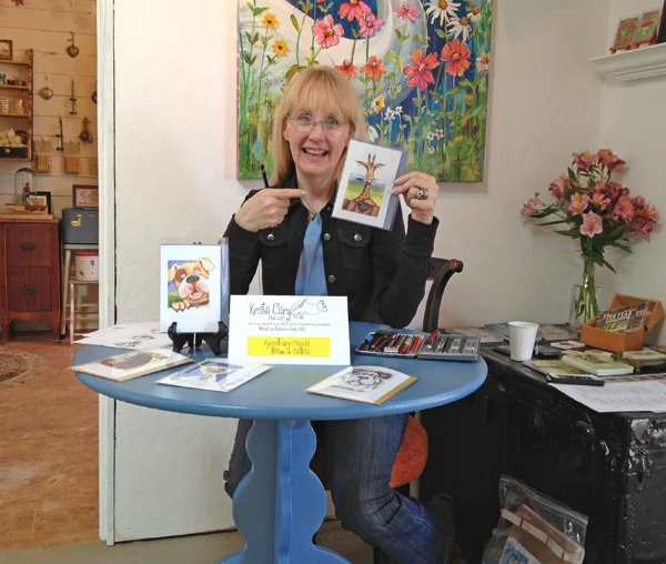 Krista Cary showing her greeting card collection