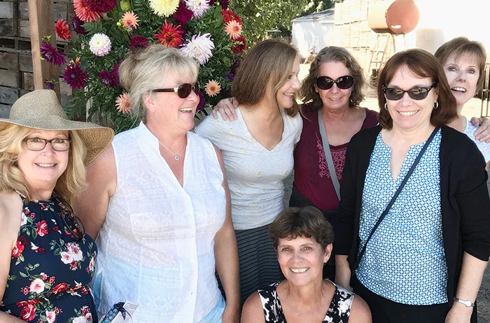 We talked some guy into taking our photo in front of the dahlia barn.
