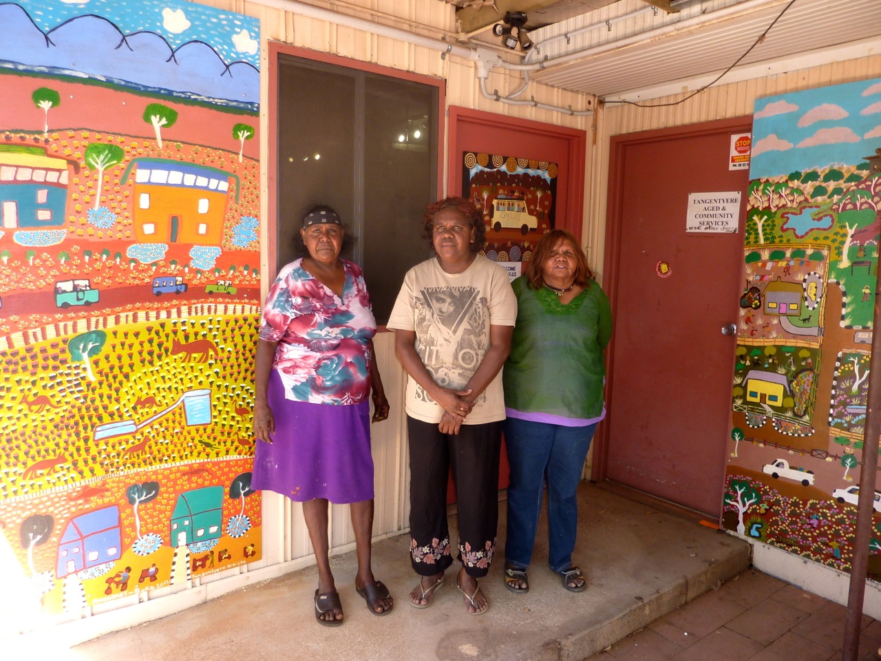 L-R Margaret Boko, Louise Daniels and Betty Conway in front of the new paintings