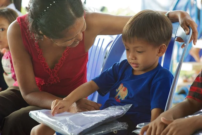 PonLu with his caretaker, before the burn accident