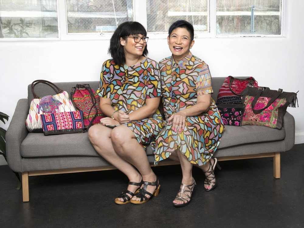 Sharidan in Ngurlu Pleated Sheath by Rowena Nungarrayi Larry and Chutisa in Ngurlu and Karlangu Waisted Shirt Dress by Rowena Nungarrayi Larry and Mary Napangardi Gallagher. 