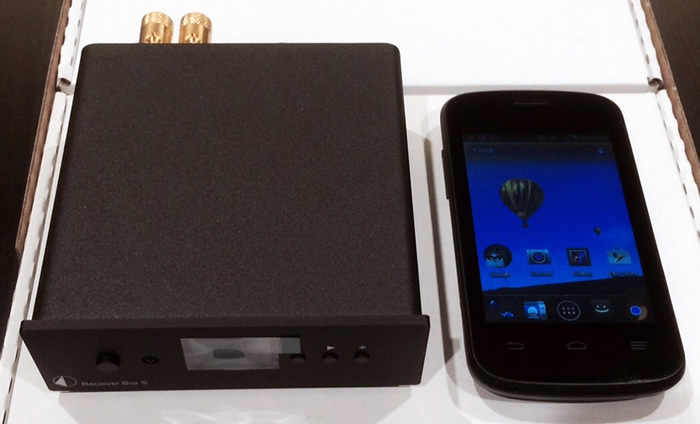 The deceptively small, but incredibly well-built (& heavy) Pro-Ject Receiver Box S, sitting next to my Android phone.