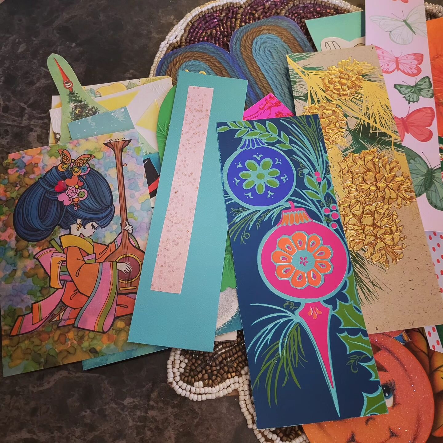 A hobby of mine is making bookmarks from greeting cards. I have a shoebox-sized collection of these -- some funny, some pretty, some festive!  I don't use them often enough now that so much of my reading is done via Kindle, but I still enjoy making t