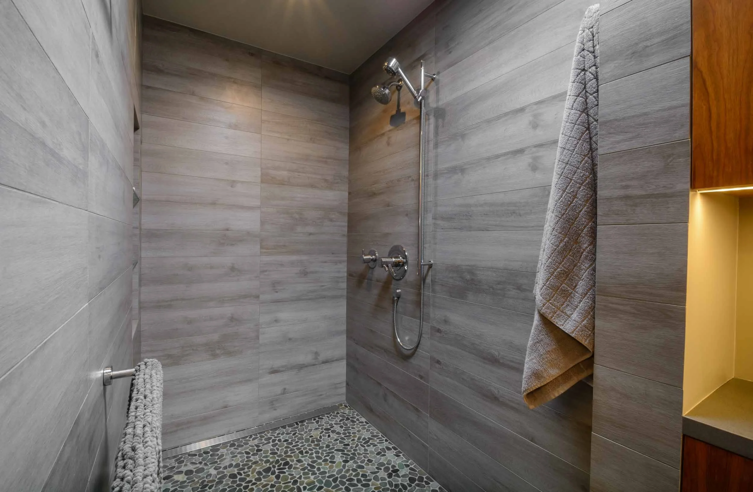 Master bath shower has the look and feel of a spa