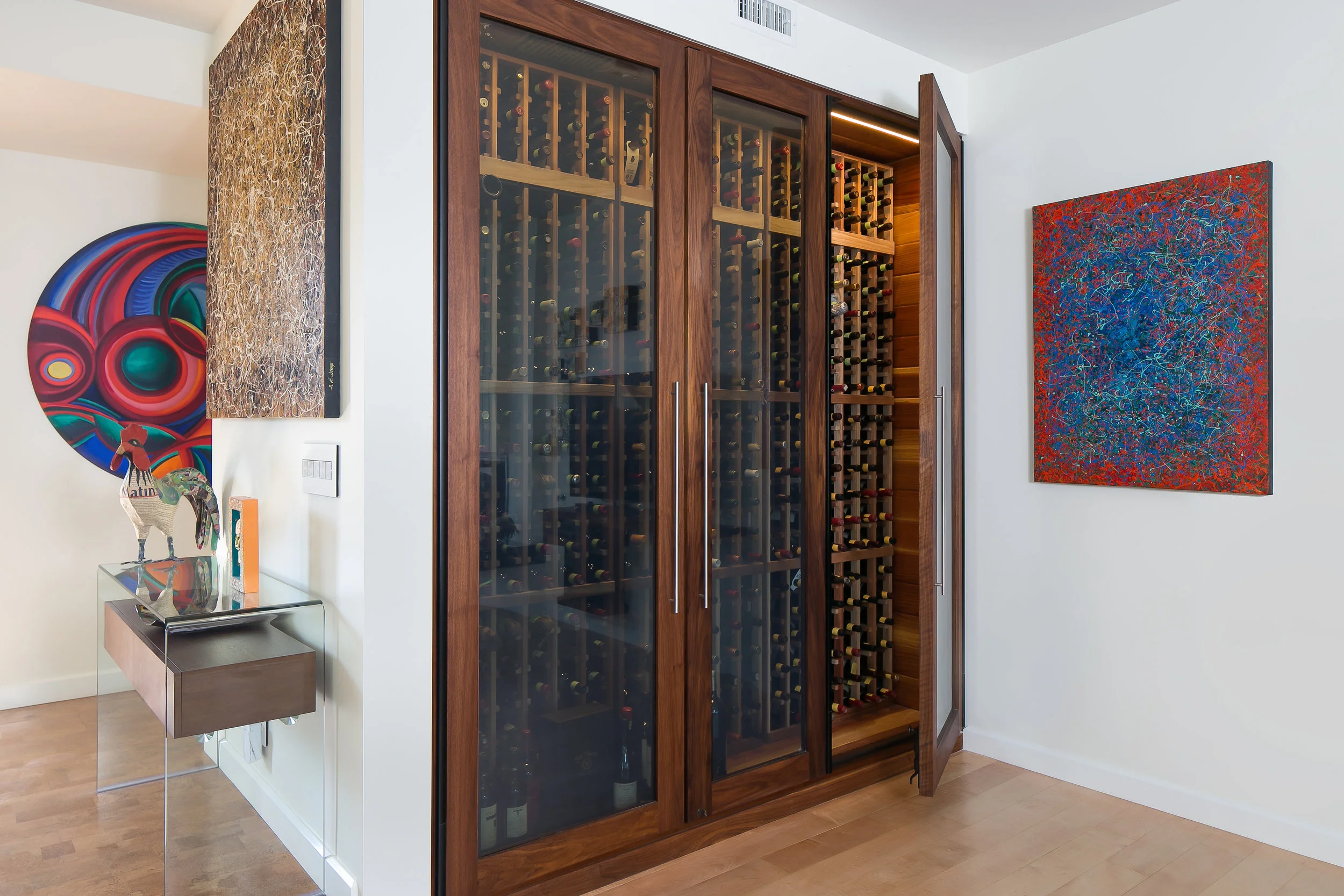 This custom cedar and walnut wine cooler replaced the dated 50's built in bar