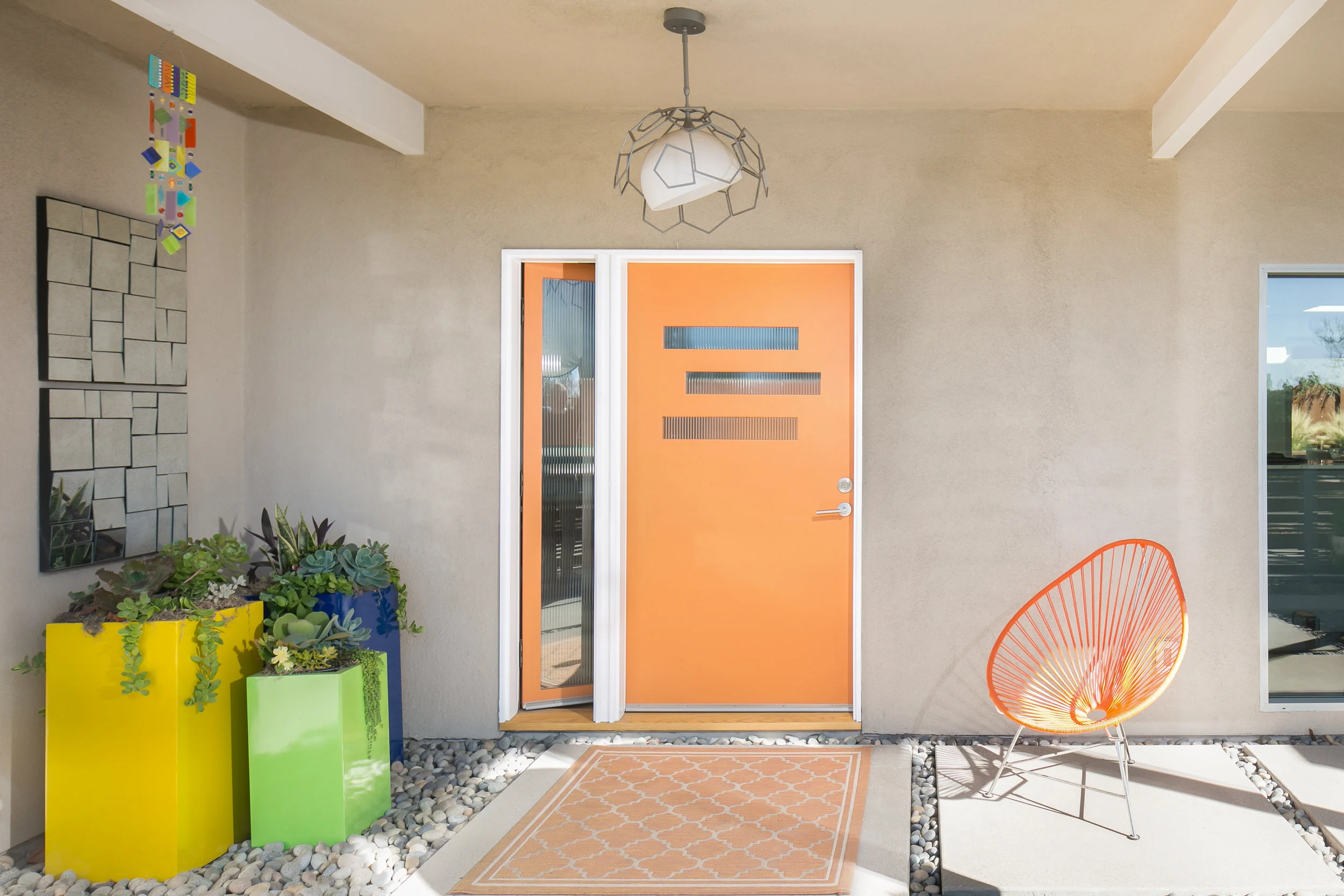This custom entry door with reeded glass and operable sidelite