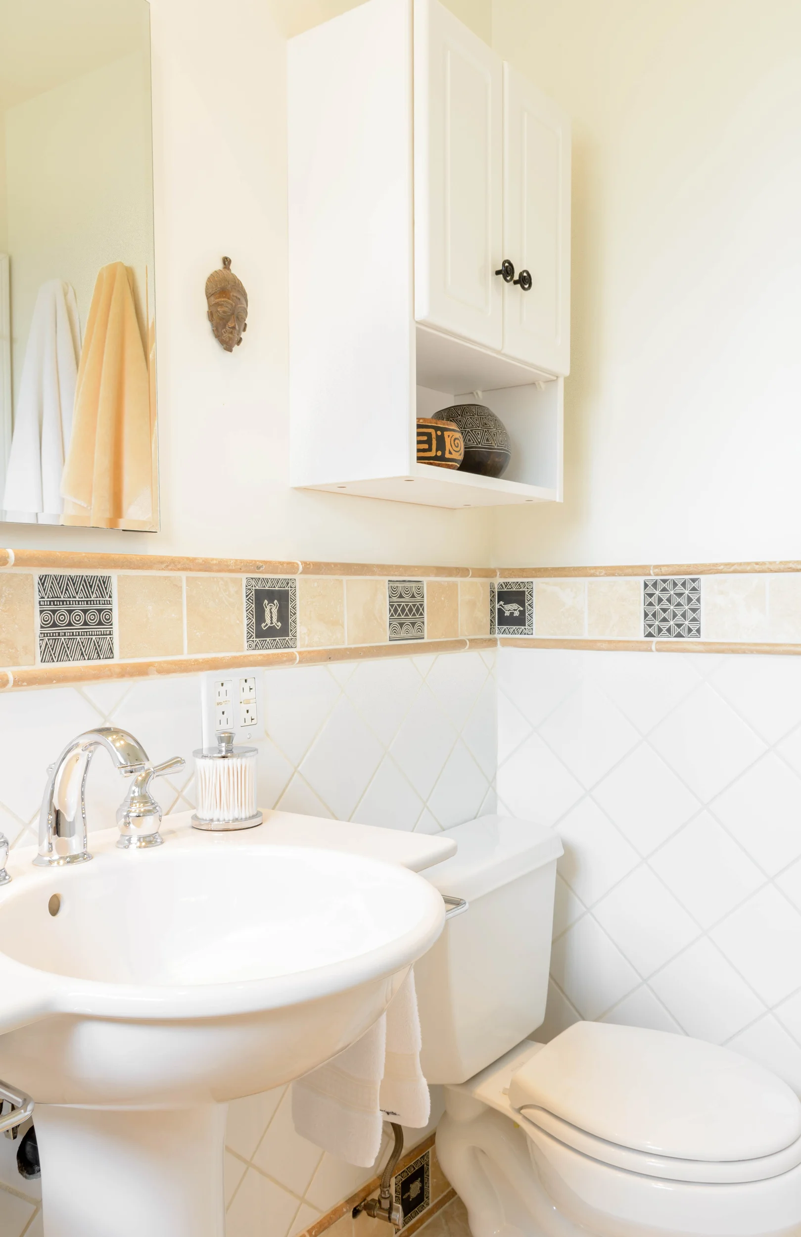 Small bathroom with white pedestal sink and diagonal field tile