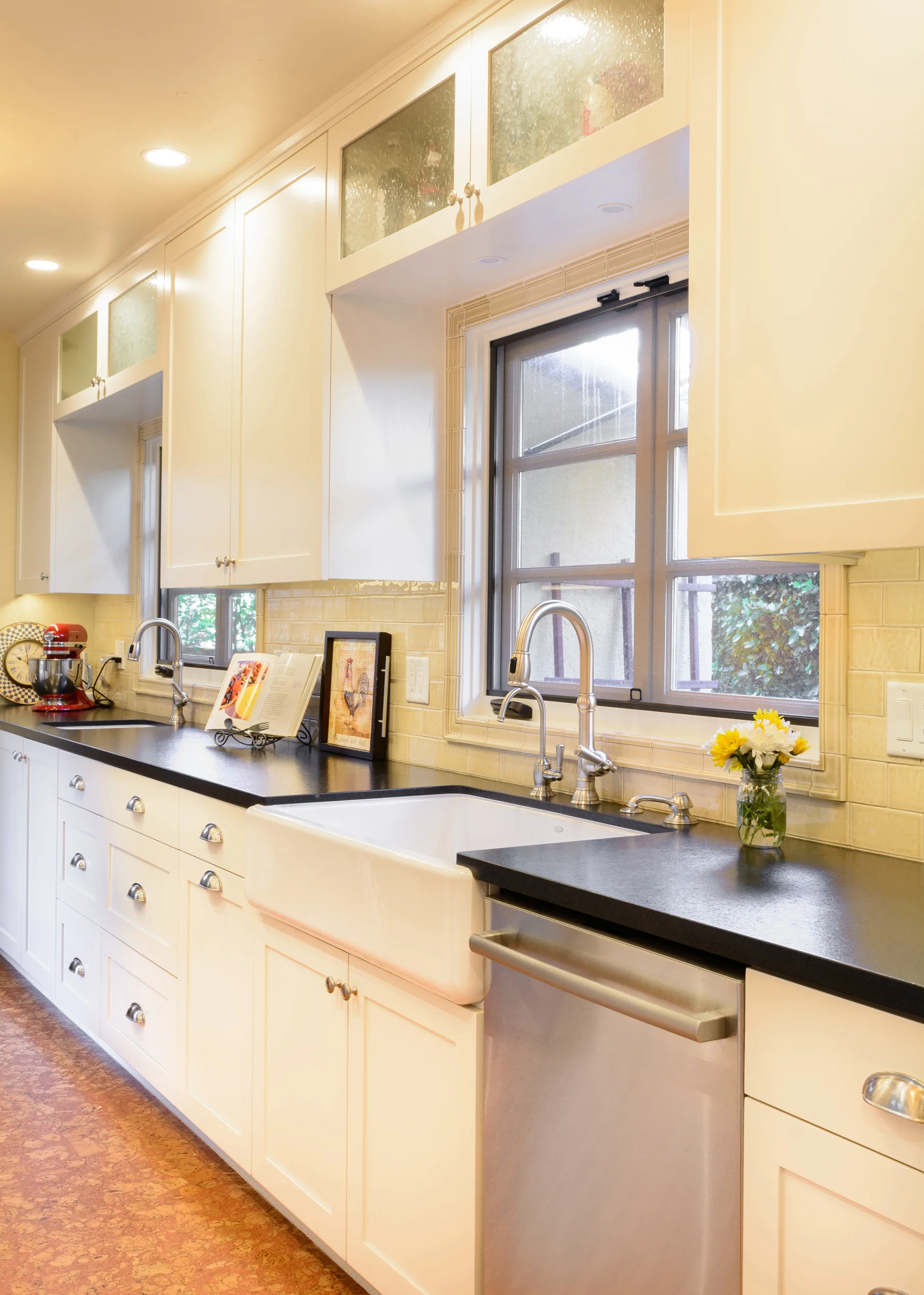 The farmhouse sink, also known as apron sink, constitute another key feature for this old world kitchen
