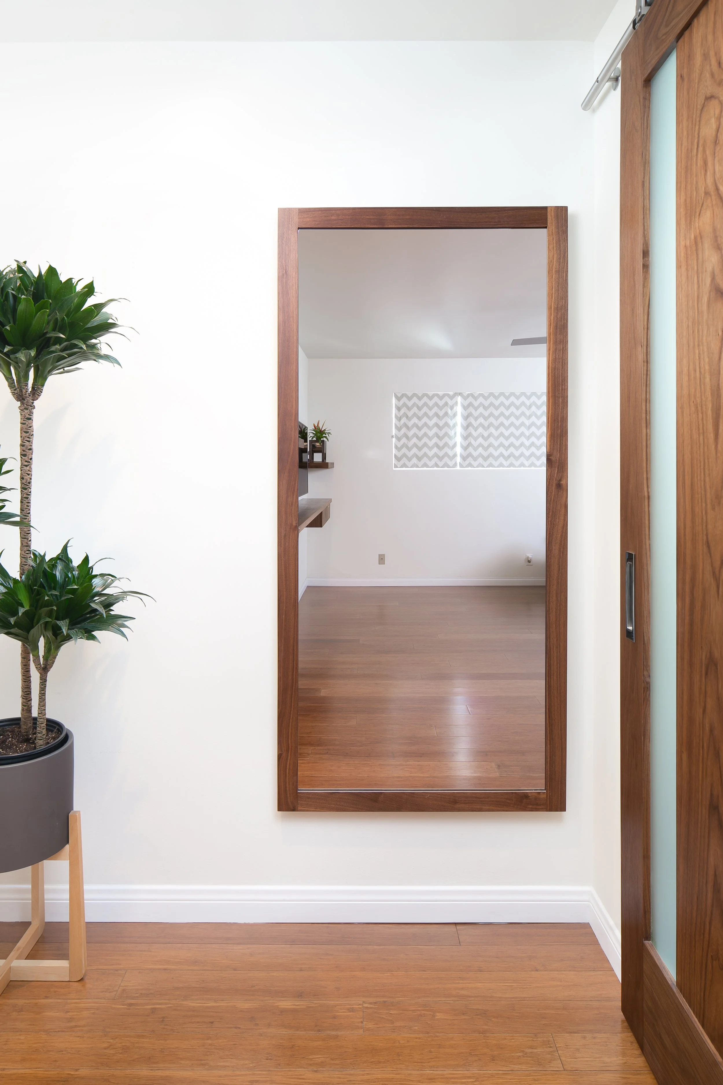 Walnut mirror frame and barn door with frosted glass
