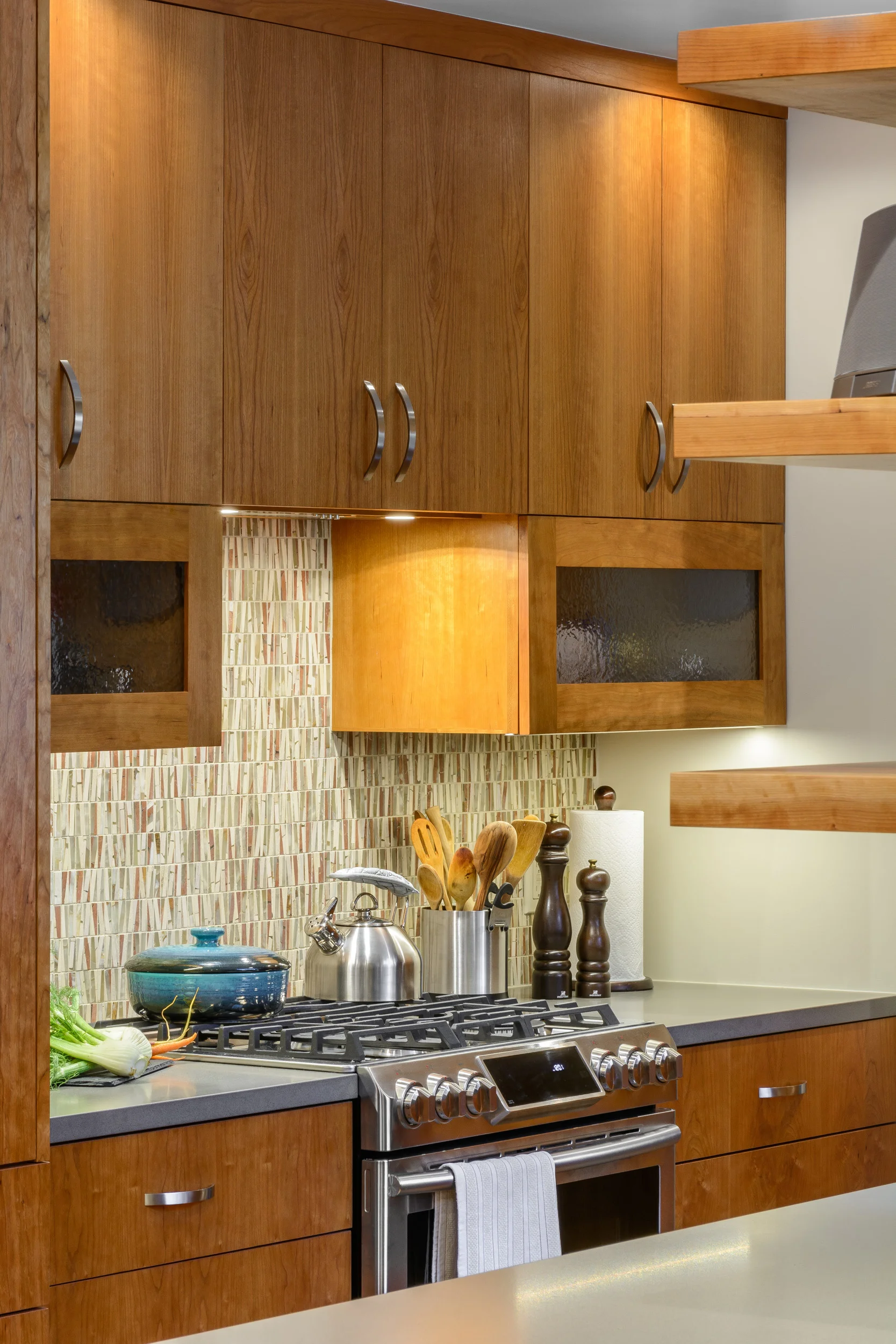 Lots of light for the cooking area of this contemporary kitchen: LED recessed lighting and under cabinet lighting in addition to natural light