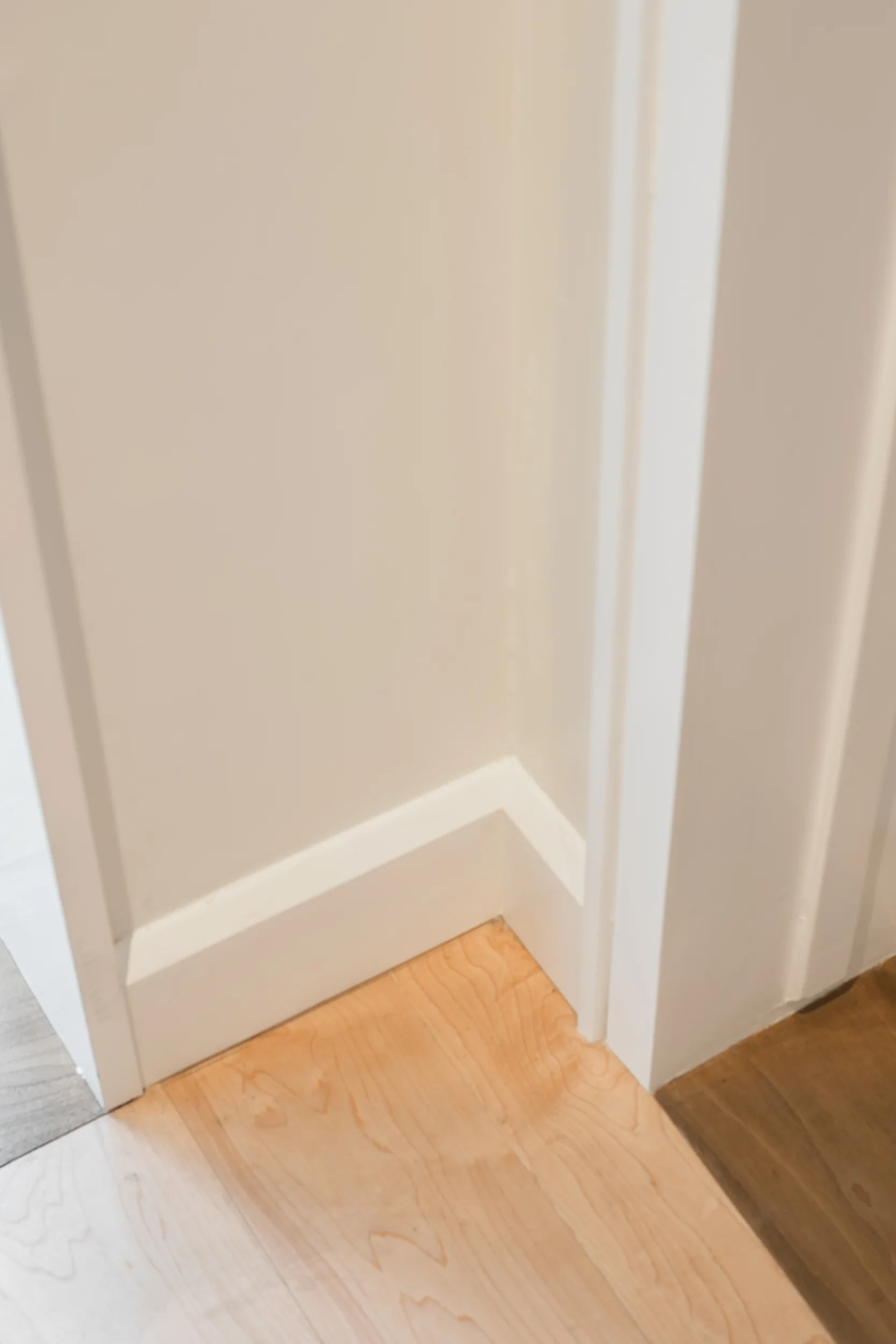 Walnut threshold, maple floor and custom casing and baseboards
