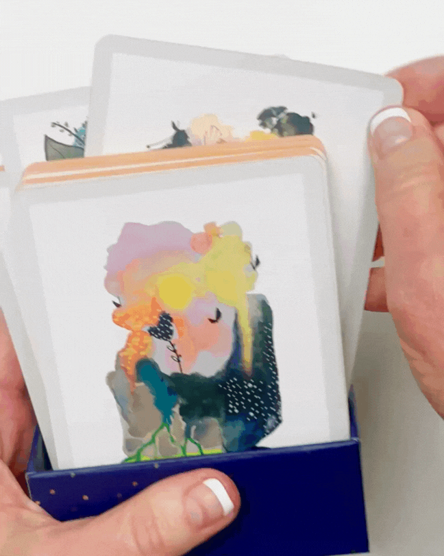 Looped clip of hands flipping through the Art Poetry Card Deck by Allison Dawrant.
