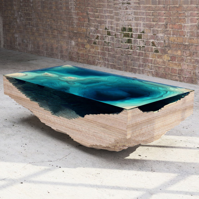 Modeled after a cross-section of the ocean's surface. This is one cool-looking table. (Via Boing Boing )