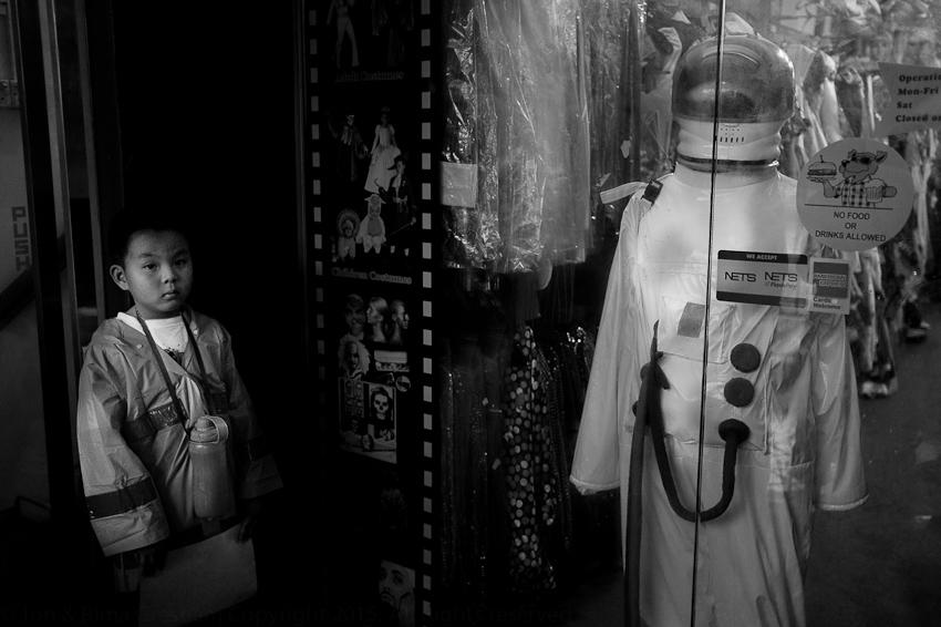  Waiting for the funeral procession outside a fancy dress shop on Kampung Bahru Rd 