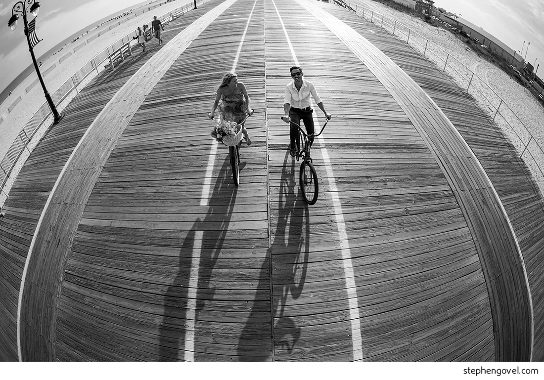 ocean city engagement photos sunset water beach boardwalk bikes marsh reflections