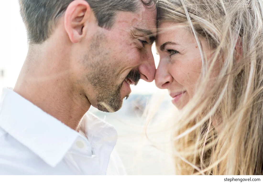ocean city engagement photos sunset water beach boardwalk bikes marsh reflections