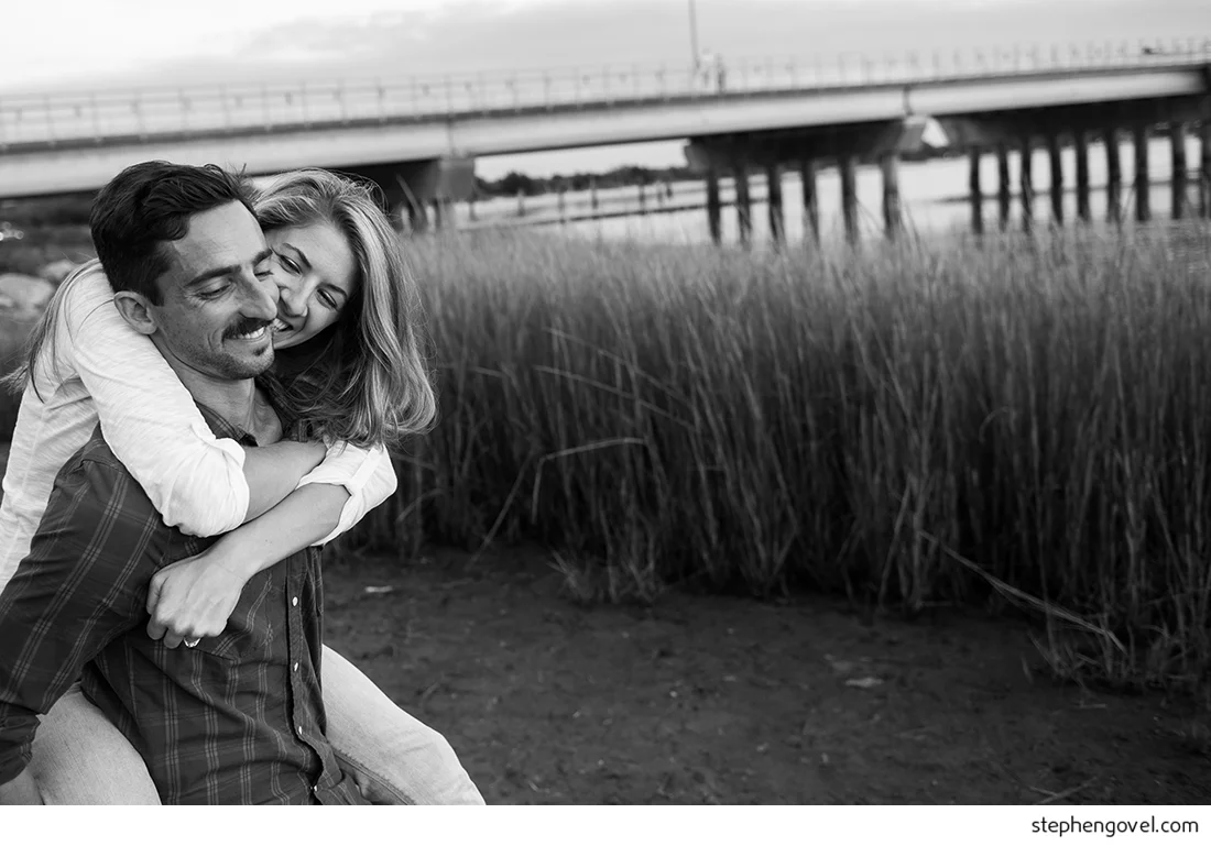 ocean city engagement photos sunset water beach boardwalk bikes marsh reflections