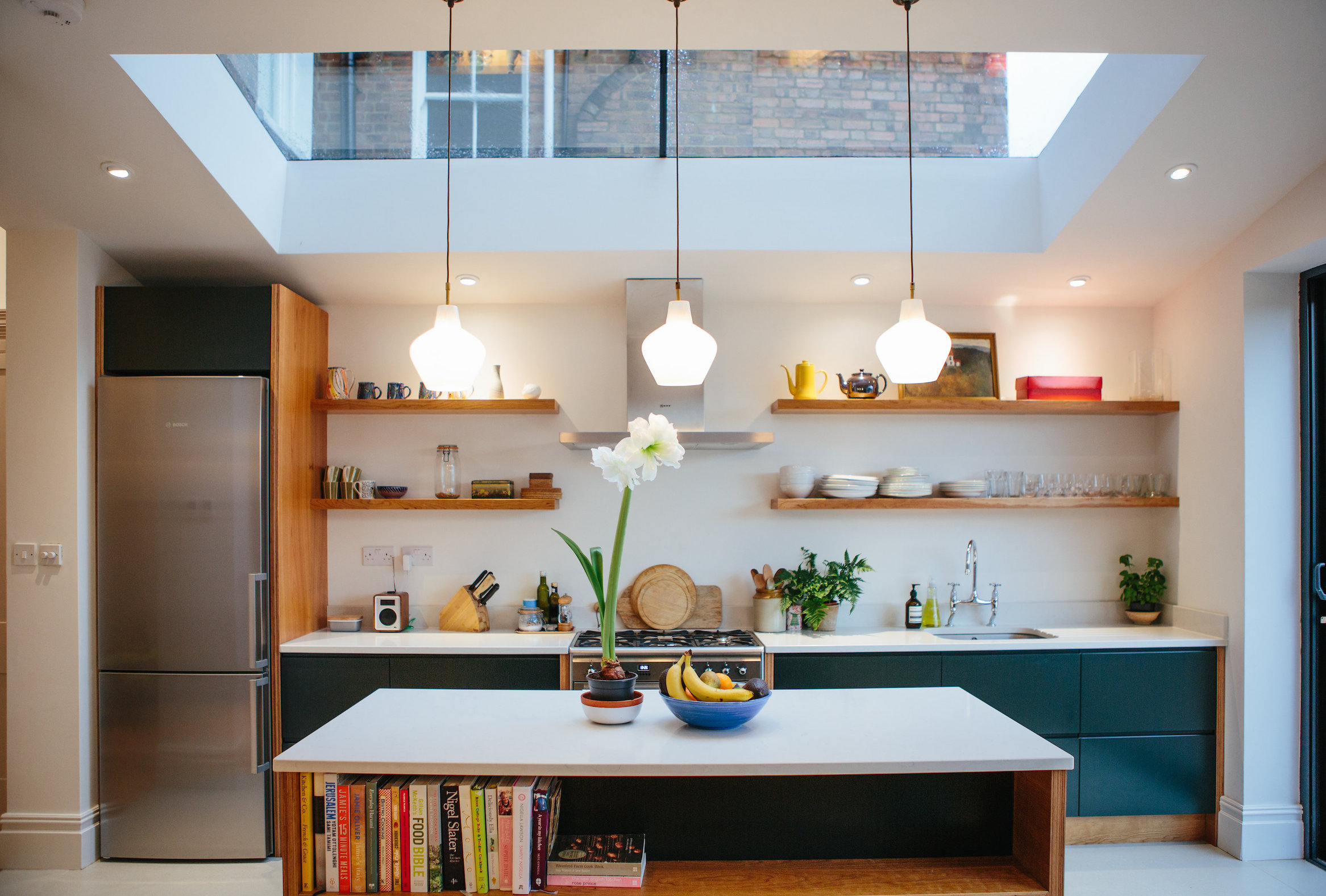 Herne Hill. Spray painted drawer fronts with routed finger pull. Cherry veneered birch ply end panels and shelves. 