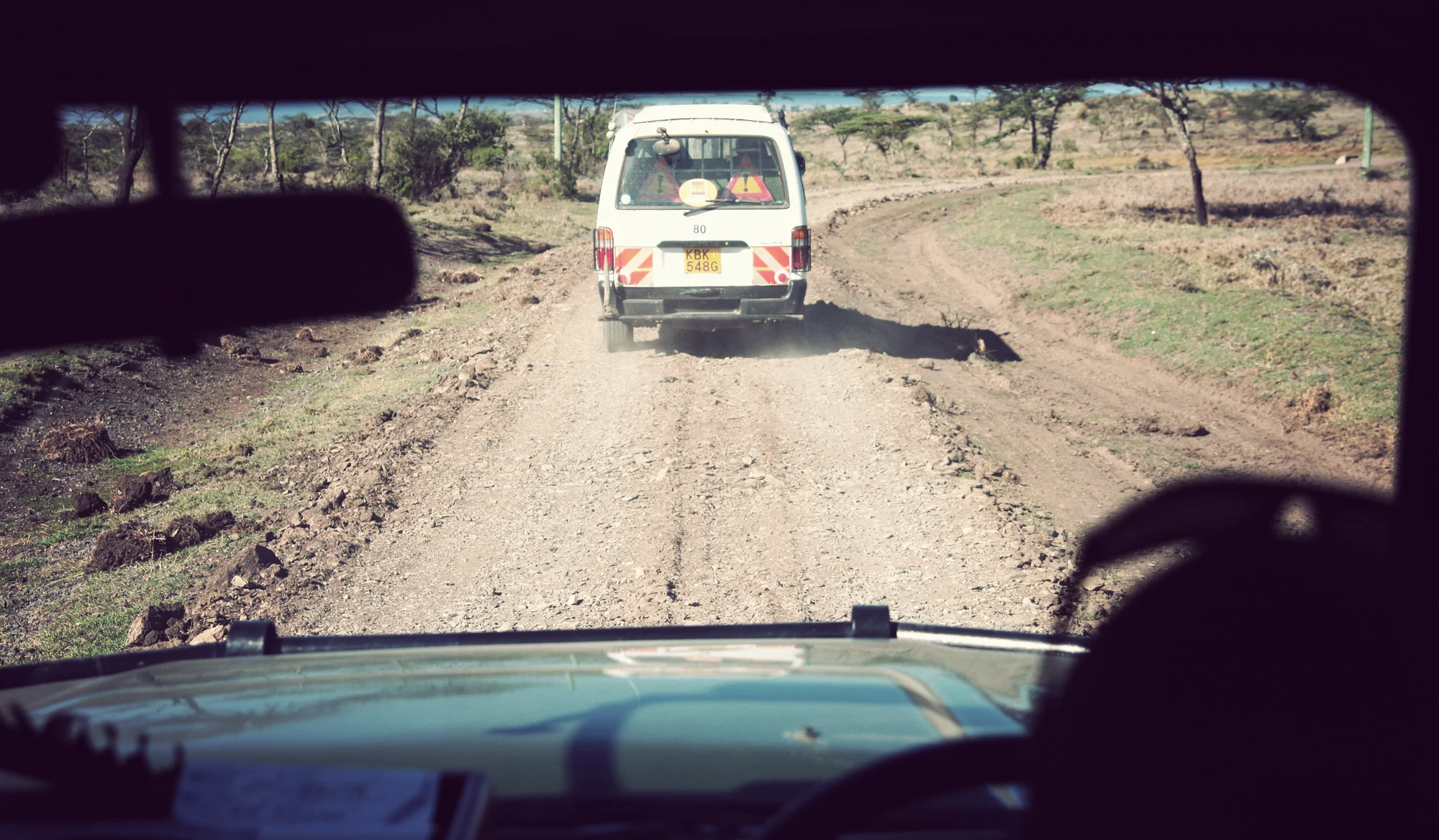 This is the 'fixed' road - a 2 or 3 km stretch whereby 'local road crews' (goat herders with reflective vests) shovel sharp field rocks onto the road to 'fill' the potholes.