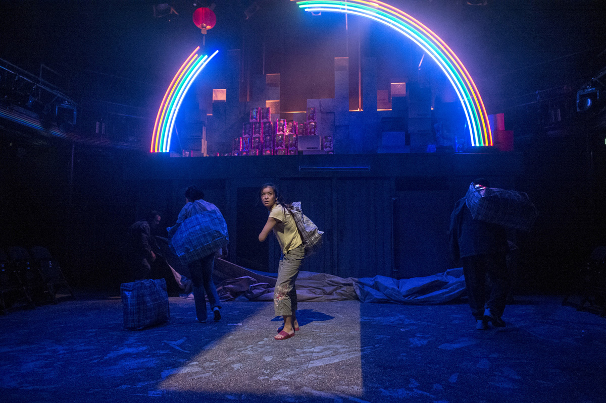 The World of Extreme Happiness / By Frances Ya-Chu Cowhig / National Theatre Shed / September 2013 Direction: Michael Longhurst Lighting: Philip Gladwell Sound: Ben and Max Ringham PRESS Chloe Lamford's design offers up neon rainbows and pink dolls who judder like puppets on a string. ★★★★THE GUARDIAN The grime-meets-neon design is spot-on ★★★★THE SUNDAY TIMES the design from Chloe Lamford is excellent ★★★★THE INDEPENDENT ★★★★THE TIMES the rough and ready Shed aesthetic suits this project splendidly and Chloe Lamford’s simple but effective design of illuminated boxes of “Made in China” dolls begins to look more and more sinister. ★★★★THE EVENING STANDARD Chloe Lamford’s design sees tarpaulin-covered shacks collide with gaudy neon rainbows, glowing with the tawdry false promise of an elusive pot of gold. ★★★★METRO