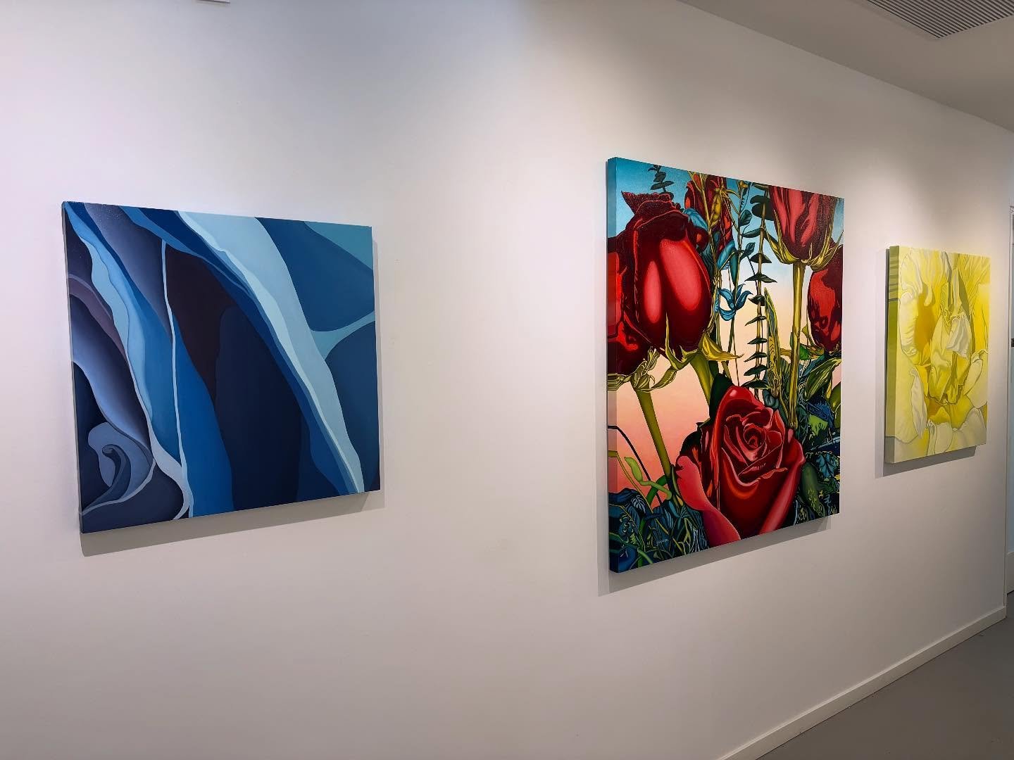 My primary colour wall, ready for the Art Crawl #primarycolours #red #yellow #blue #paintings #flowers #abstract #primarycolors #northshoreartcrawl #nsartcrawl @welchstreetstudios