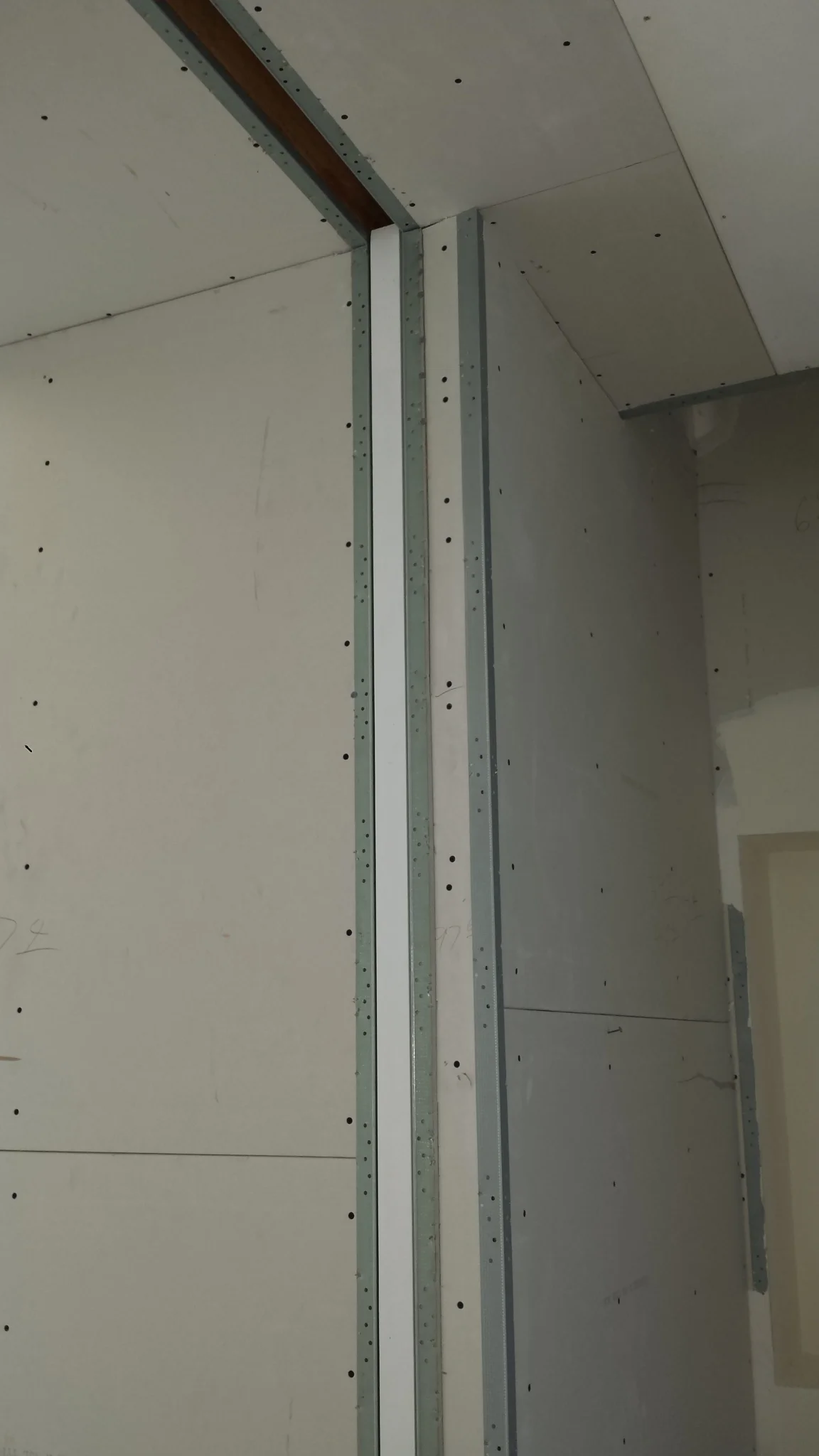 Note that the drywall crew consists of three different specialties: hangers (put the raw boards on the walls), metal guys (install edge metal around openings and corners), and finishers (apply joint compound to make the seams smooth for paint).