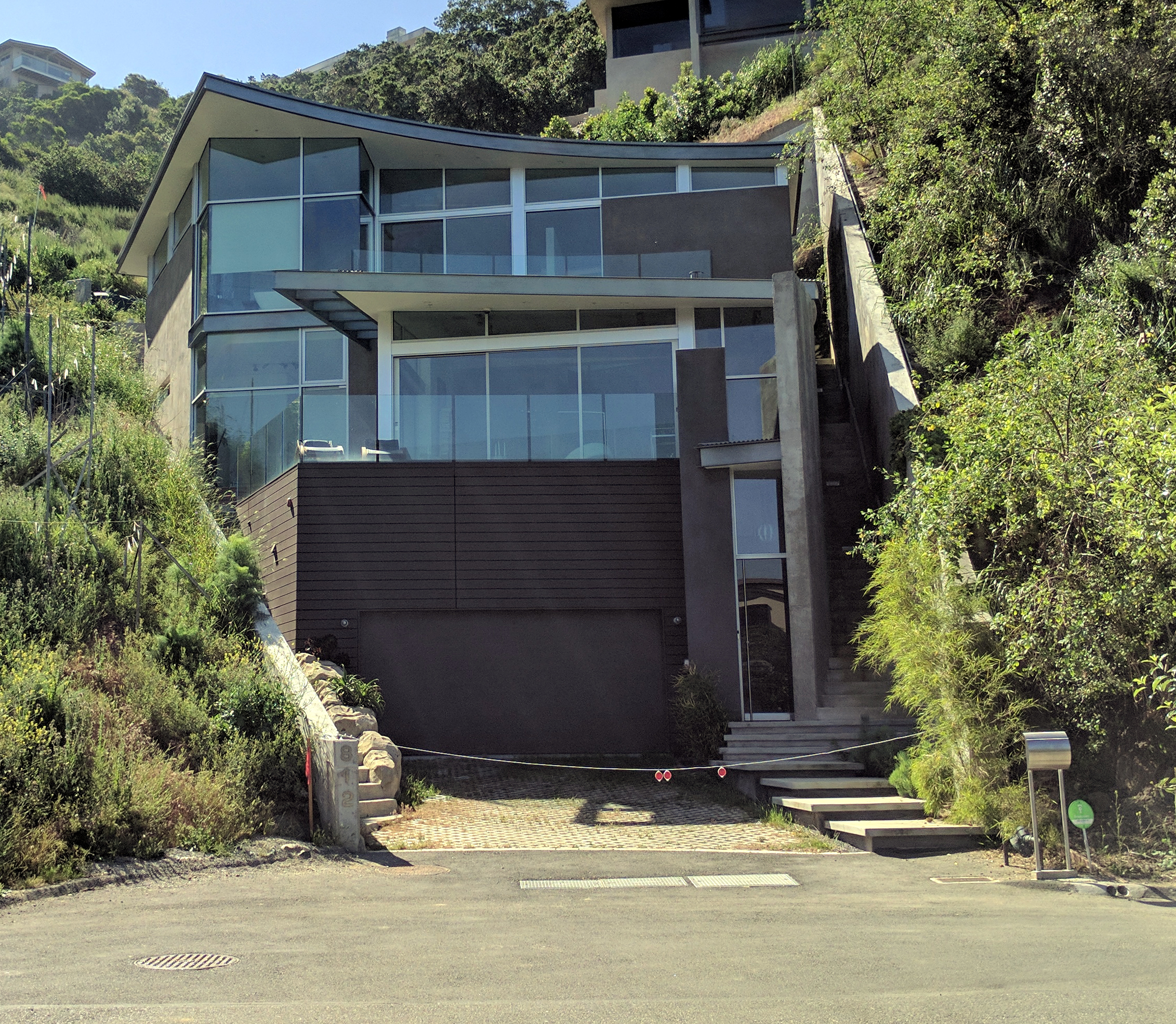 GAINSBOROUGH DRIVE Scope: New Construction. 2,498 Square Feet. Status: Complete. The lot for this contemporary residence was extremely constrained by its physical shape and size, a water course flowing through it, an endangered species habitat, and very strict local zoning ordinances. Given these constraints, the solution was to insert the house minimally into the hillside, which maximized the lots' potential and reduced its impact on the surrounding landscape and its appearance of outward mass. The residence is 3 bedrooms, 3 baths, in 3 stories. Completed by Horst Architects; Keith Messick, Project Manager.