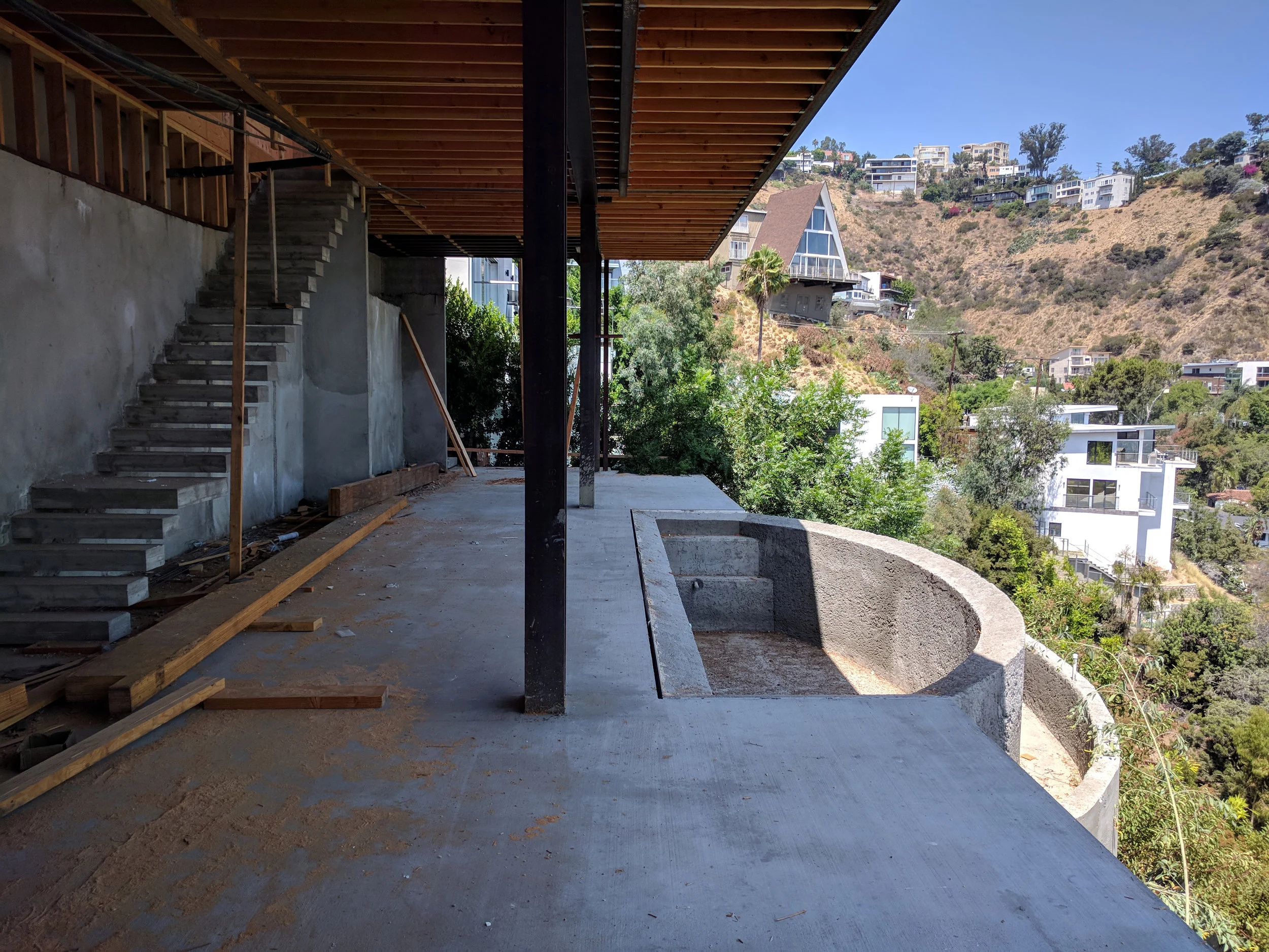 Lower Level. Note the floating stairs. The stairs cantilever from the wall. Ceilings are 14'-0" in height.