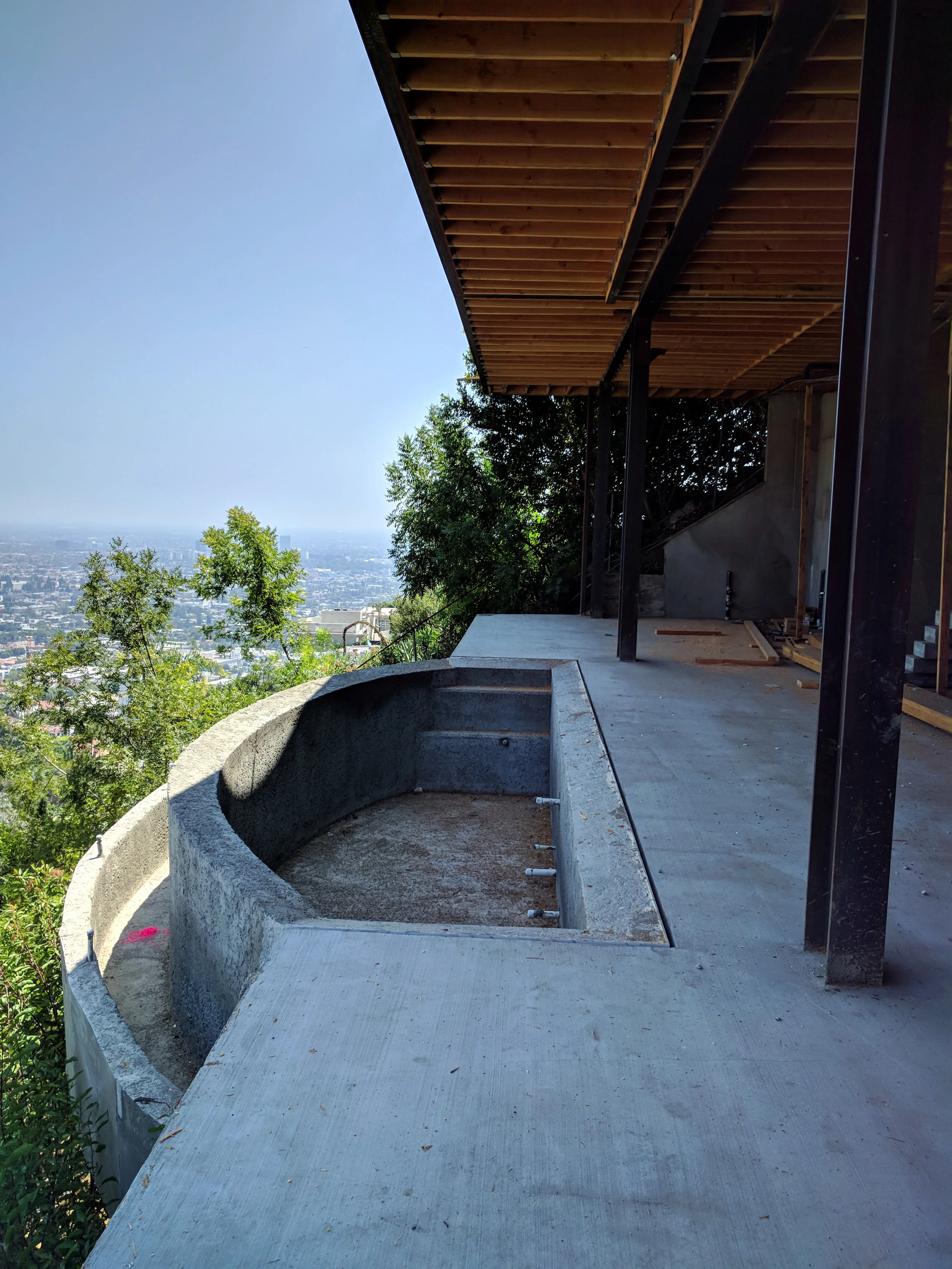 Lower Level. Glass door system will sit about one foot in front of steel columns. Note the zero edge, infinity pool.
