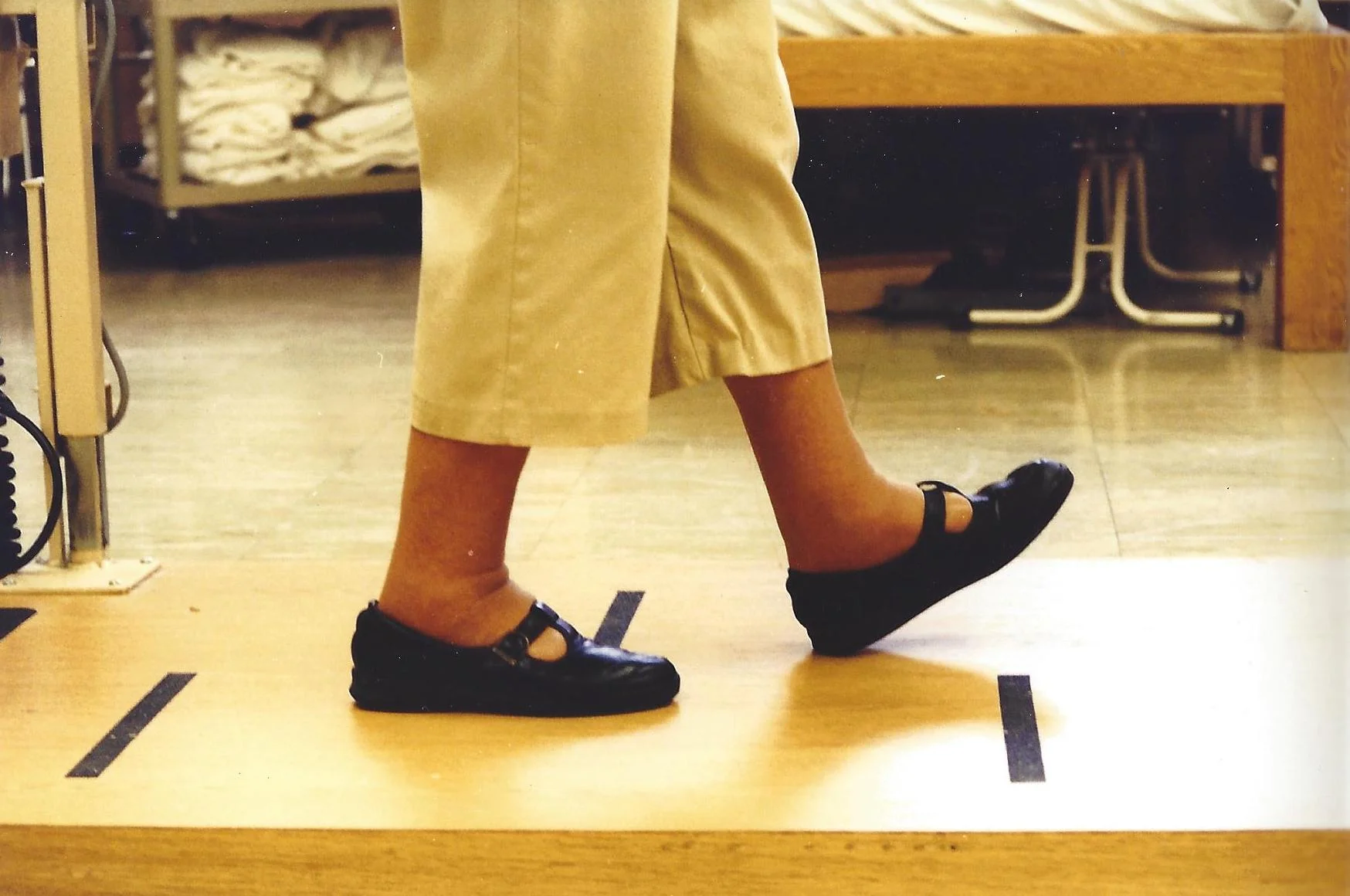 Notice the lifted sole of the foot, toes pointed slightly upward. First touching on the heel.