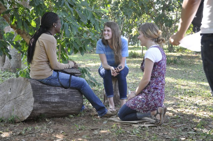 andrea and mindi talking to a girl on campus