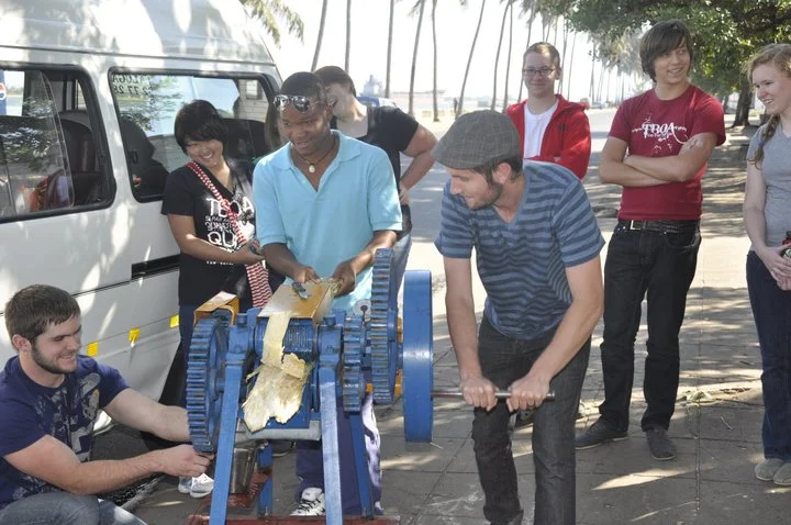 matt trying his hand at making sugar cane juice