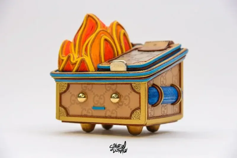 Dumpster Fire upcycled luxury vinyl toy sculptures by Gabriel Dishaw