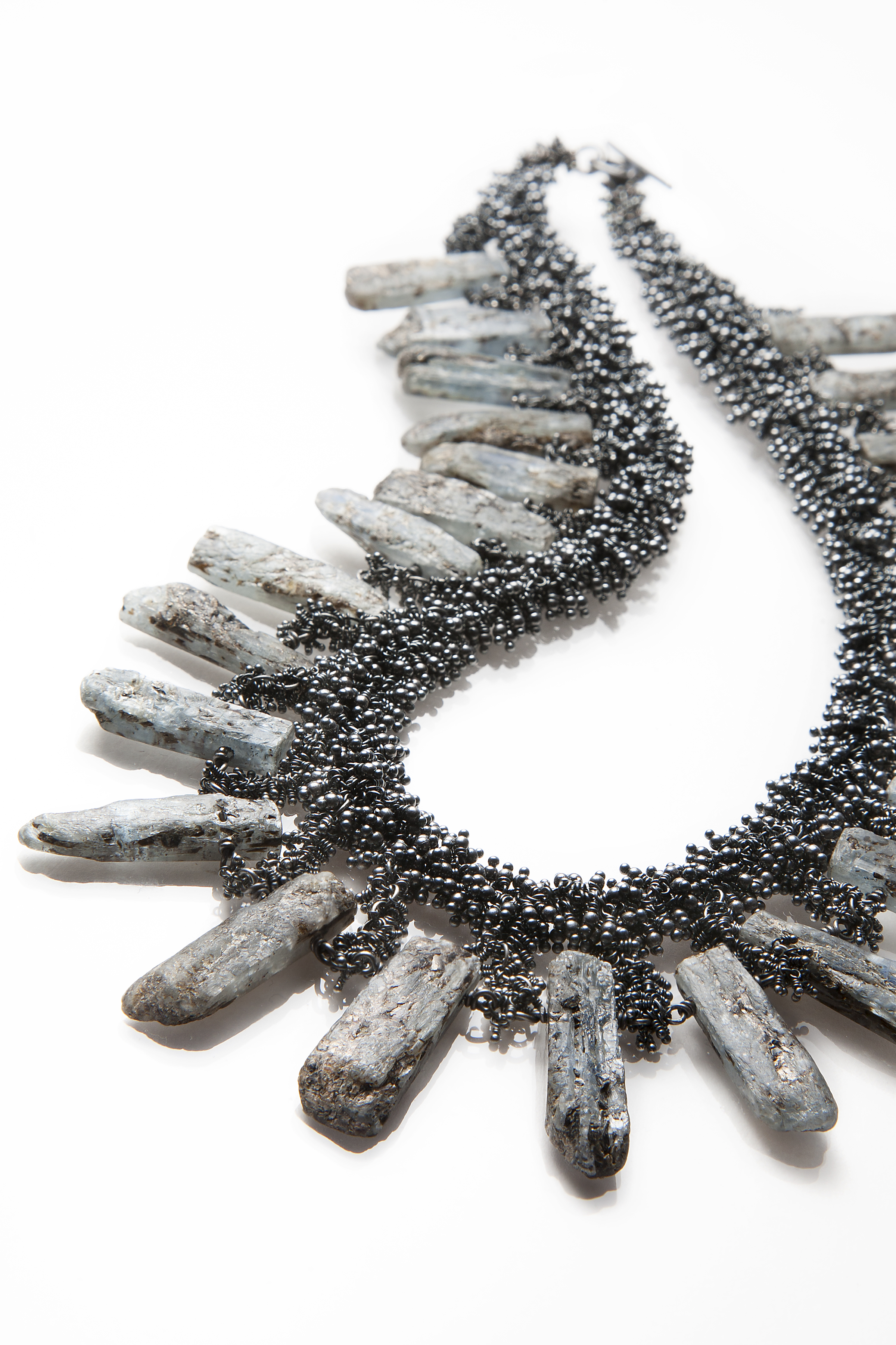 Michelle Pajak-Reynolds’s one-of-a-kind Nimue necklace from her Undina Collection featuring 270 carats (total weight) raw blue kyanite accented with 2,208 oxidized recycled sterling silver pins. Photo credit: JuleImages